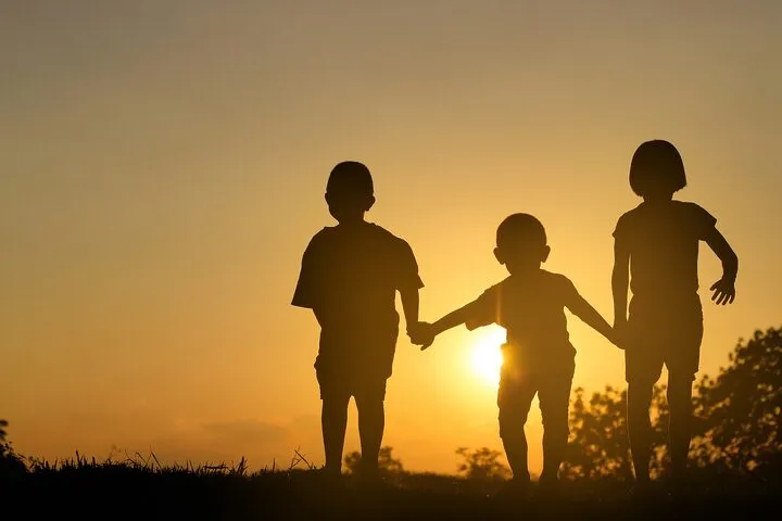 Happy,Children,Jumping,On,Sunset,Background