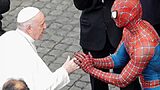 Pope Francis greets a person dressed as Spiderman, at the Vatican